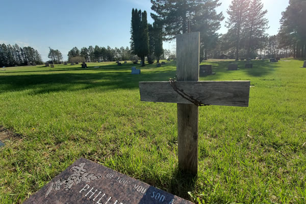 Image of a cross at the cemetery